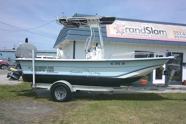 The Image of 2009 Carolina Skiff 198 DLV Elite boat on trailer outside Grand Slam Boat Sales. - 1
