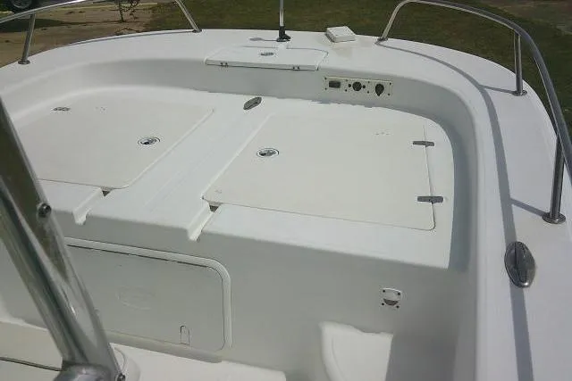 Slide: The Image of 2009 Carolina Skiff 198 DLV Elite boat deck with storage compartments. - 11