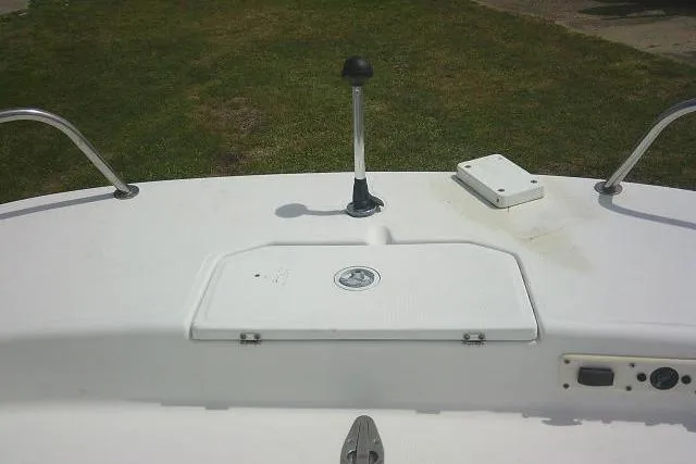 Slide: The Image of 2009 Carolina Skiff 198 DLV Elite boat deck with storage compartment and railing. - 12