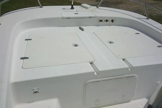 Slide: The Image of 2009 Carolina Skiff 198 DLV Elite boat deck with storage compartments. - 13