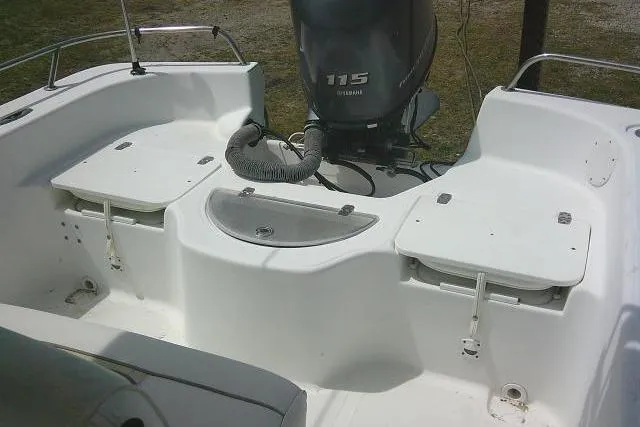 Slide: The Image of 2009 Carolina Skiff 198 DLV Elite boat interior with Yamaha 115 engine. - 17