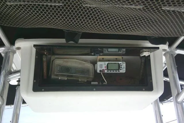 Slide: The Image of Storage compartment on a 2009 Carolina Skiff 198 DLV Elite boat with electronic equipment. - 21