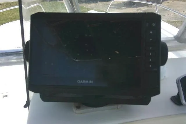 Slide: The Image of Garmin GPS device on 2009 Carolina Skiff 198 DLV Elite boat dashboard. - 22