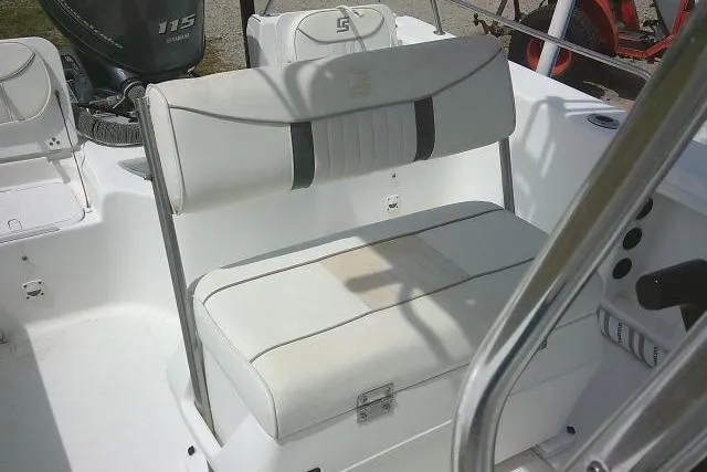 Slide: The Image of 2009 Carolina Skiff 198 DLV Elite boat interior with white seating and console. - 23
