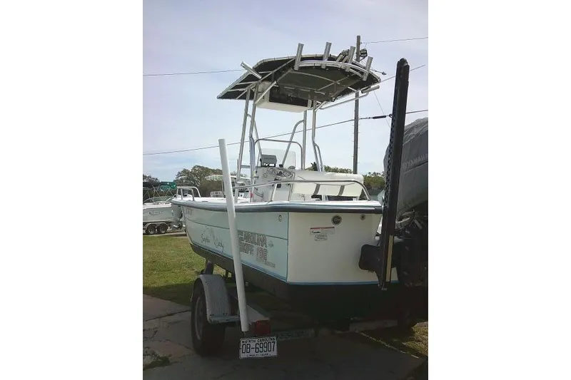Slide: The Image of 2009 Carolina Skiff 198 DLV Elite boat on trailer, parked outdoors. - 7