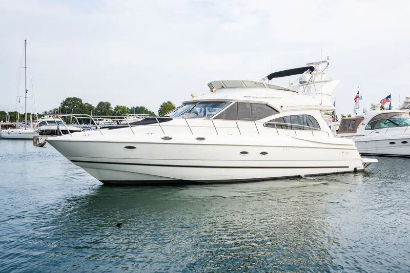 The Image of 2001 Cruisers Yachts 5000 Sedan Sport docked in harbor. - 0