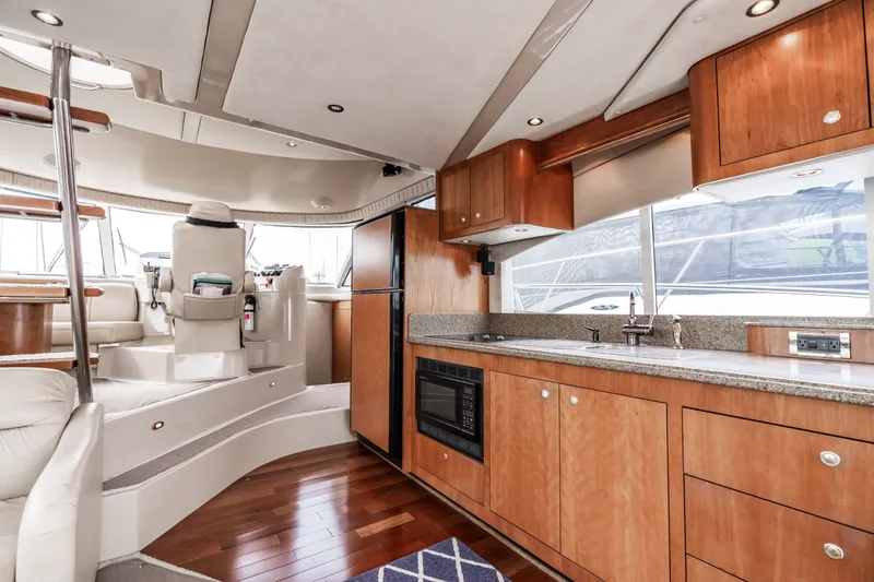 Slide: The Image of Interior of 2001 Cruisers Yachts 5000 Sedan Sport with modern kitchen. - 13