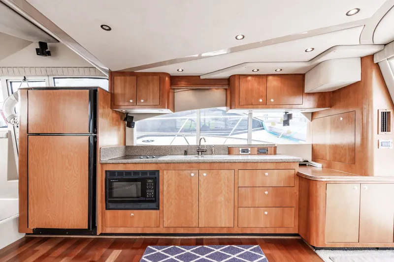 Slide: The Image of Interior of 2001 Cruisers Yachts 5000 Sedan Sport, modern kitchen. - 16