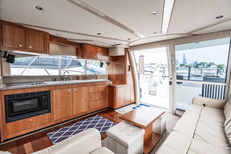 Slide: The Image of Interior of 2001 Cruisers Yachts 5000 Sedan Sport with kitchen and sofa. - 20