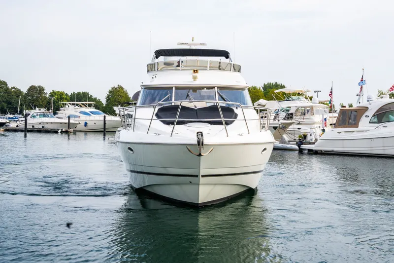 Slide: The Image of 2001 Cruisers Yachts 5000 Sedan Sport in harbor. - 25