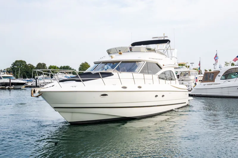 Slide: The Image of 2001 Cruisers Yachts 5000 Sedan Sport on the water. - 26