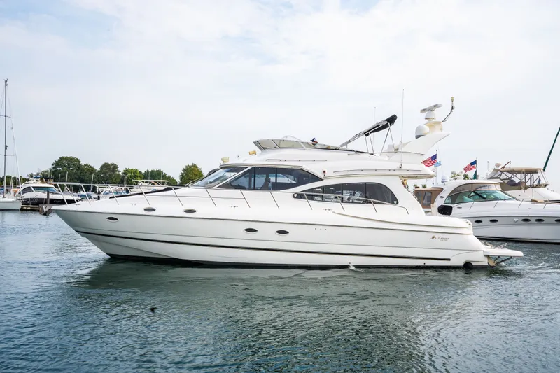 Slide: The Image of 2001 Cruisers Yachts 5000 Sedan Sport on calm water. - 27