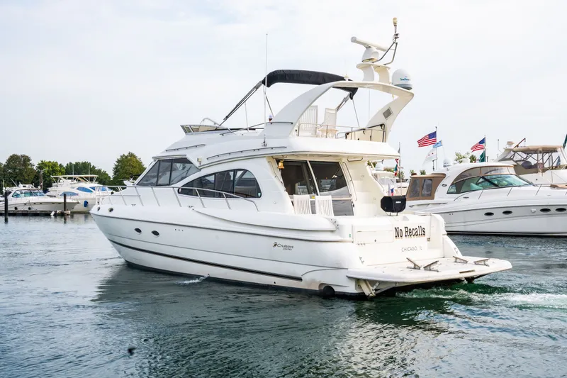 Slide: The Image of 2001 Cruisers Yachts 5000 Sedan Sport in harbor. - 28