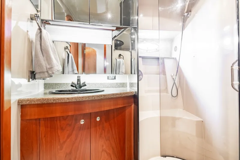 Slide: The Image of Luxurious bathroom in a 2001 Cruisers Yachts 5000 Sedan Sport. - 7