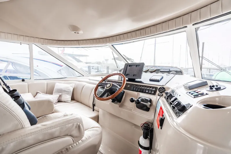 Slide: The Image of Interior of 2001 Cruisers Yachts 5000 Sedan Sport, luxurious helm station. - 8