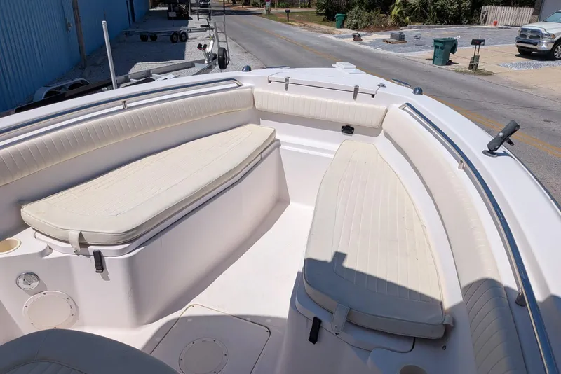 Slide: The Image of 2004 Grady-White Chase 273 boat interior with cushioned seating and cup holders. - 11