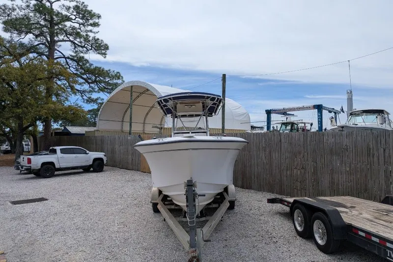 Slide: The Image of 2004 Grady-White Chase 273 boat on trailer in outdoor storage area. - 3