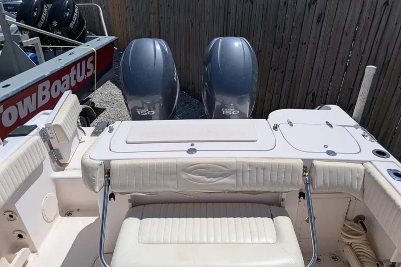 Slide: The Image of 2004 Grady-White Chase 273 boat with twin Yamaha 150 engines, docked near TowBoatUS. - 8