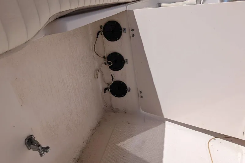 Slide: The Image of Interior view of a 2004 Grady-White Chase 273 boat, showing wiring and fixtures. - 9