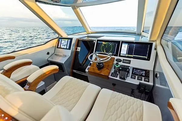 Slide: The Image of Manufacturer Provided Image: Luxurious helm of 2026 Ocean Yachts 52 CC with advanced navigation systems. - 10