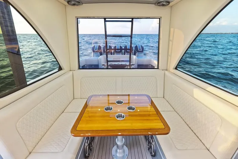 Slide: The Image of Manufacturer Provided Image: Luxurious interior of 2026 Ocean Yachts 52 CC with ocean view and elegant seating. - 11