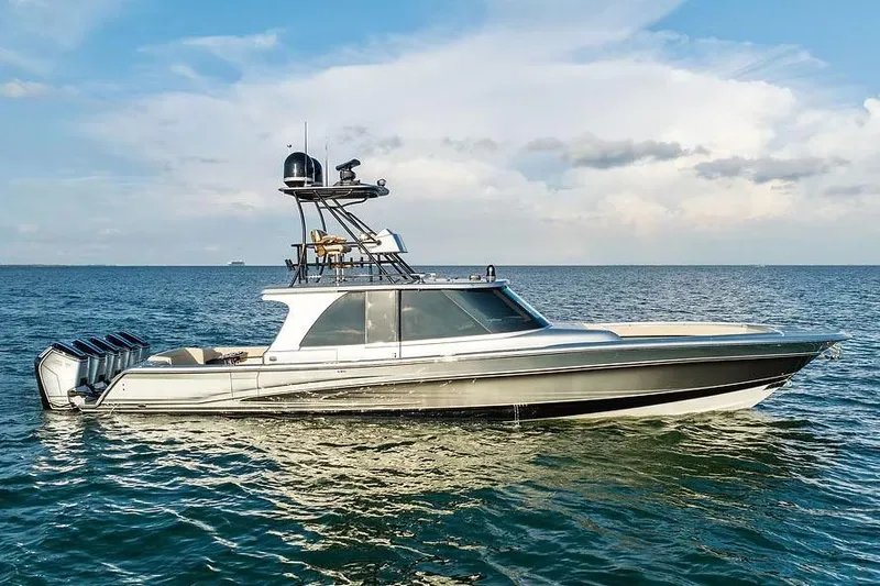 Slide: The Image of Manufacturer Provided Image: 2026 Ocean Yachts 52 CC cruising on open water under a clear sky. - 2