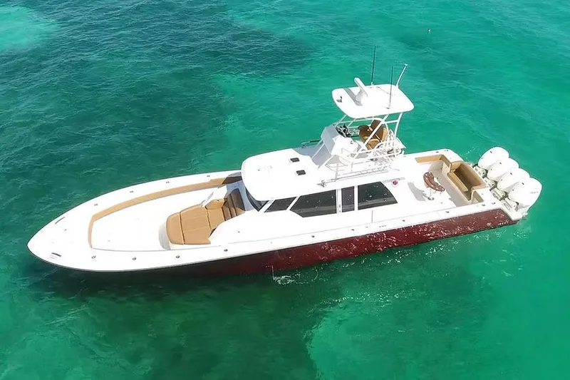 Slide: The Image of Manufacturer Provided Image: Aerial view of 2026 Ocean Yachts 52 CC on turquoise water. - 3