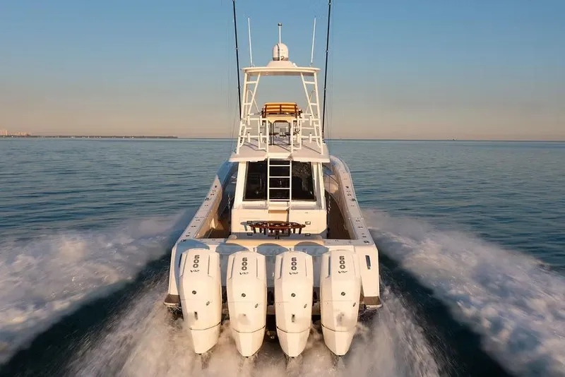 Slide: The Image of Manufacturer Provided Image: 2026 Ocean Yachts 52 CC cruising on open water at sunset. - 6