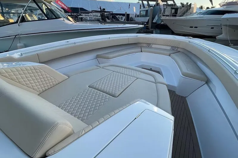 Slide: The Image of Manufacturer Provided Image: Luxurious seating area on 2026 Ocean Yachts 52 CC boat, featuring elegant beige upholstery. - 8