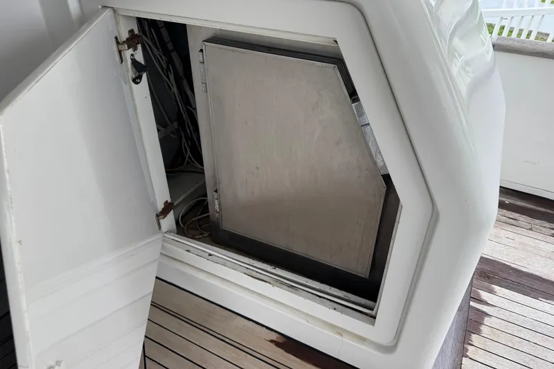Slide: The Image of Open compartment on 1998 Azimut 85 Ultimate yacht, revealing interior wiring and equipment. - 12