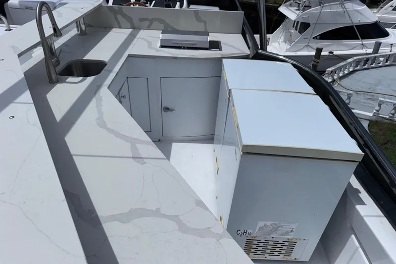 Slide: The Image of Outdoor kitchen area on a 1998 Azimut 85 Ultimate yacht, featuring a sink and storage. - 15