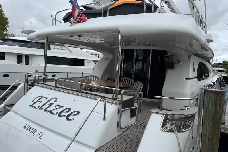 Slide: The Image of Luxury yacht Azimut 85 Ultimate, 1998 model, docked in Miami with elegant outdoor seating. - 2