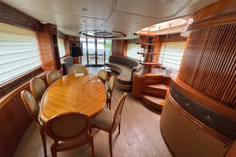 Slide: The Image of Luxurious interior of a 1998 Azimut 85 Ultimate yacht with elegant wood finishes and seating. - 21