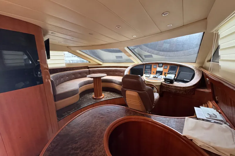 Slide: The Image of Luxurious interior of a 1998 Azimut 85 Ultimate yacht with plush seating and modern controls. - 22
