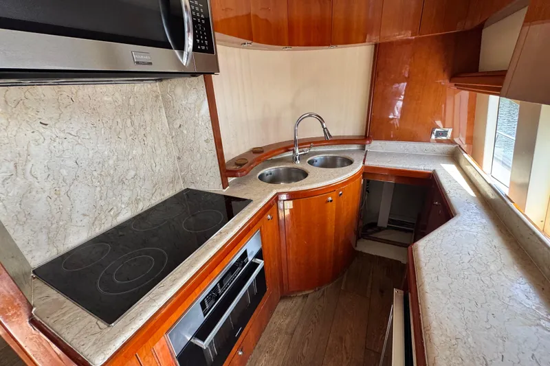 Slide: The Image of Luxurious kitchen interior of a 1998 Azimut 85 Ultimate yacht with modern appliances. - 24