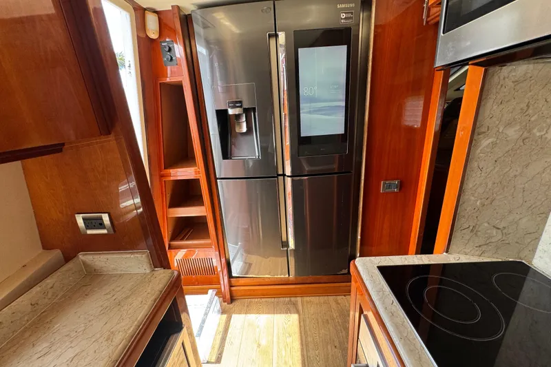 Slide: The Image of Luxurious kitchen interior of 1998 Azimut 85 Ultimate yacht with modern appliances. - 25