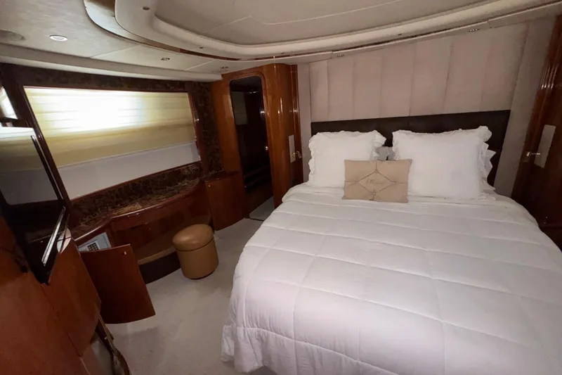 Slide: The Image of Luxurious bedroom interior of 1998 Azimut 85 Ultimate yacht with elegant bedding. - 27