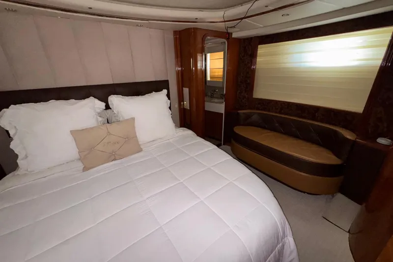 Slide: The Image of Luxurious bedroom interior of 1998 Azimut 85 Ultimate yacht with plush bedding and elegant decor. - 28
