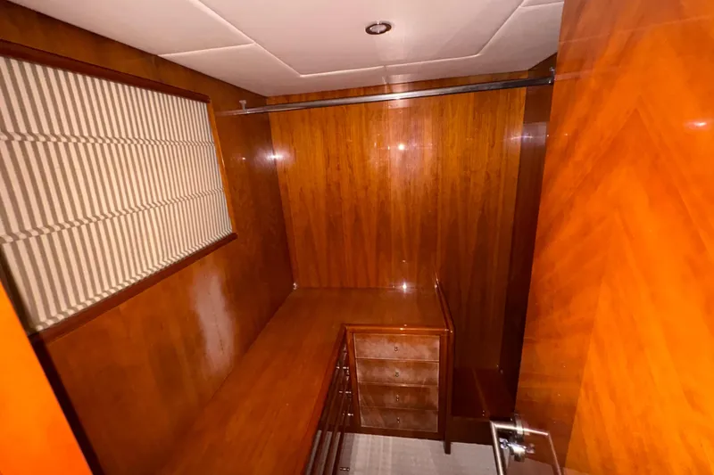Slide: The Image of Luxurious wooden interior of 1998 Azimut 85 Ultimate yacht cabin with drawers and window. - 29