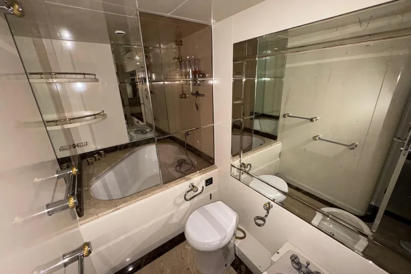 Slide: The Image of Luxurious bathroom on 1998 Azimut 85 Ultimate yacht with elegant fixtures and mirrors. - 30