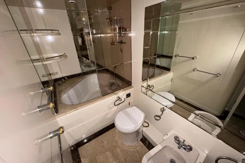 Slide: The Image of Luxurious bathroom in 1998 Azimut 85 Ultimate yacht with elegant fixtures and mirrored walls. - 31
