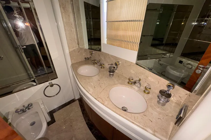 Slide: The Image of Luxurious bathroom interior of 1998 Azimut 85 Ultimate yacht with dual sinks and marble countertop. - 32