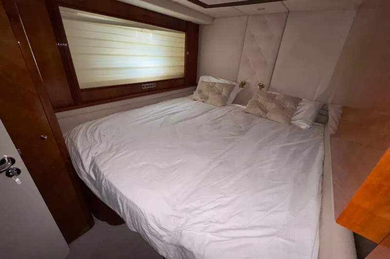 Slide: The Image of Luxurious bedroom interior of 1998 Azimut 85 Ultimate yacht with plush bedding. - 41