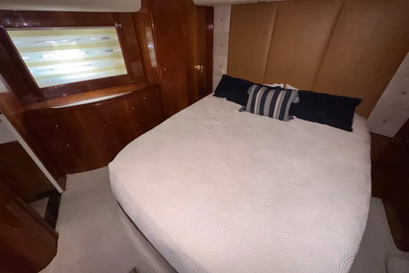 Slide: The Image of Luxurious bedroom interior of 1998 Azimut 85 Ultimate yacht with elegant wood finishes. - 44
