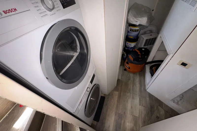 Slide: The Image of Laundry area on 1998 Azimut 85 Ultimate yacht with Bosch appliances and cleaning supplies. - 47