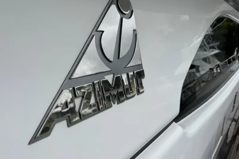 Slide: The Image of Azimut 85 Ultimate 1998 yacht logo on sleek white exterior. - 5