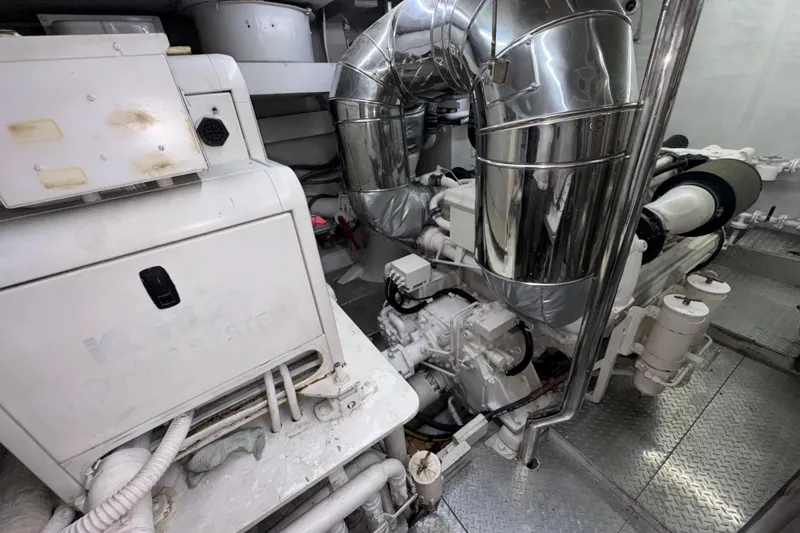 Slide: The Image of Engine room of a 1998 Azimut 85 Ultimate yacht with visible machinery and piping. - 51