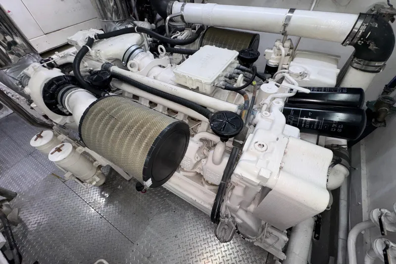 Slide: The Image of Engine room of a 1998 Azimut 85 Ultimate yacht, showcasing mechanical components. - 56