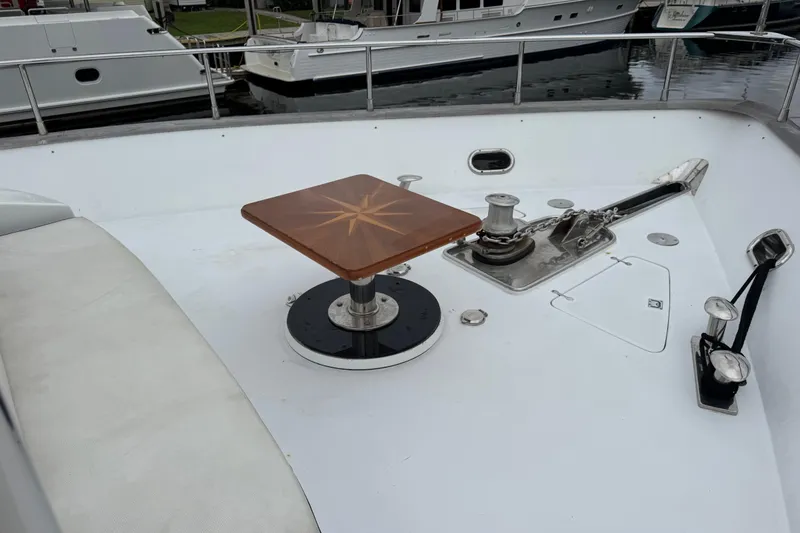 Slide: The Image of Deck of 1998 Azimut 85 Ultimate yacht with anchor and wooden table. - 9