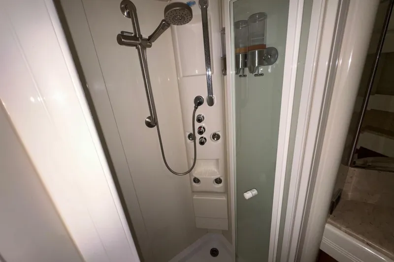 Slide: The Image of Shower area in 1998 Azimut 85 Ultimate yacht, featuring modern fixtures and dispensers. - 38